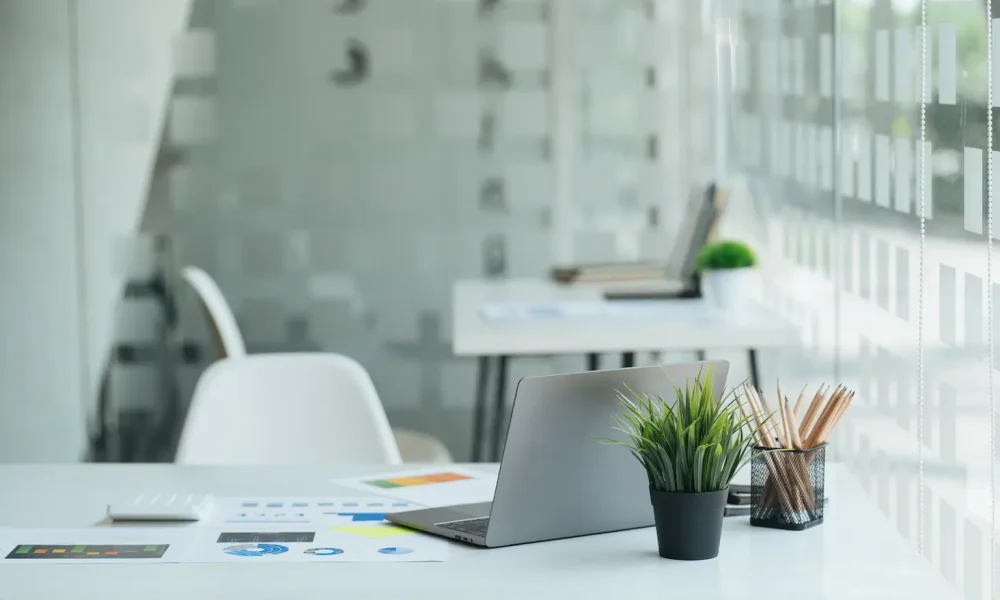 desk-with-laptop-books-and-business-office-backgr-2023-11-27-05-16-55-utc