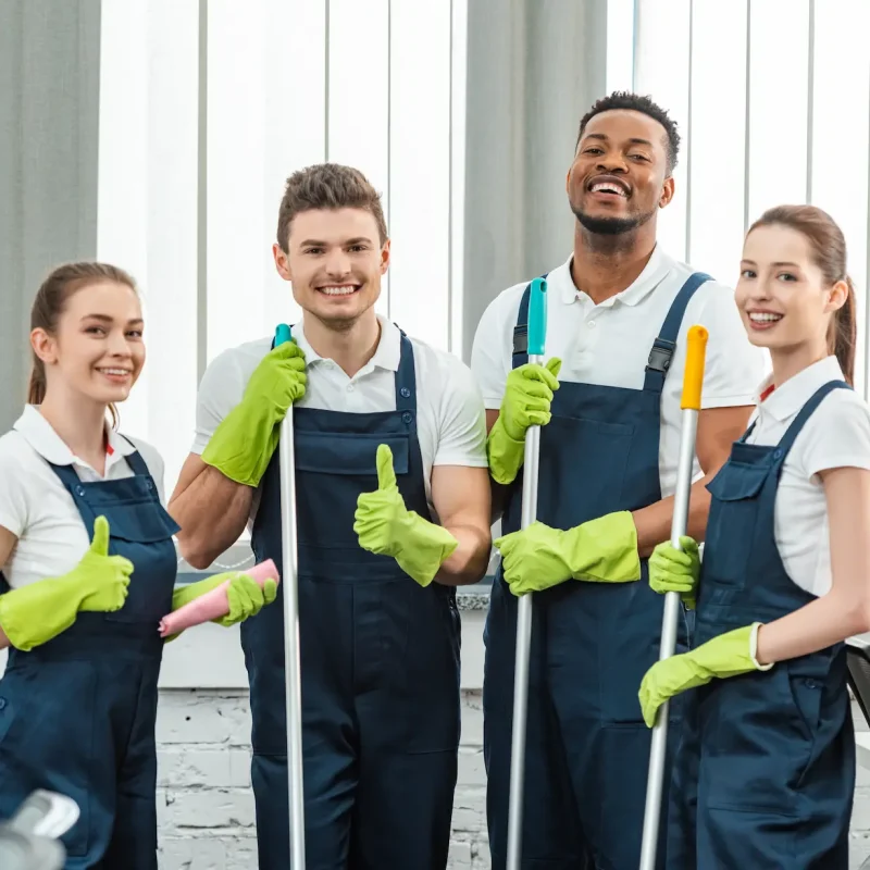 happy-multicultural-team-of-cleaners-looking-at-ca-2024-11-18-10-14-07-utc