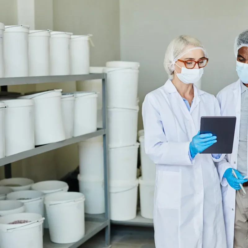 man-and-woman-using-tablet-inspecting-pharmaceutic-2024-10-04-20-38-18-utc