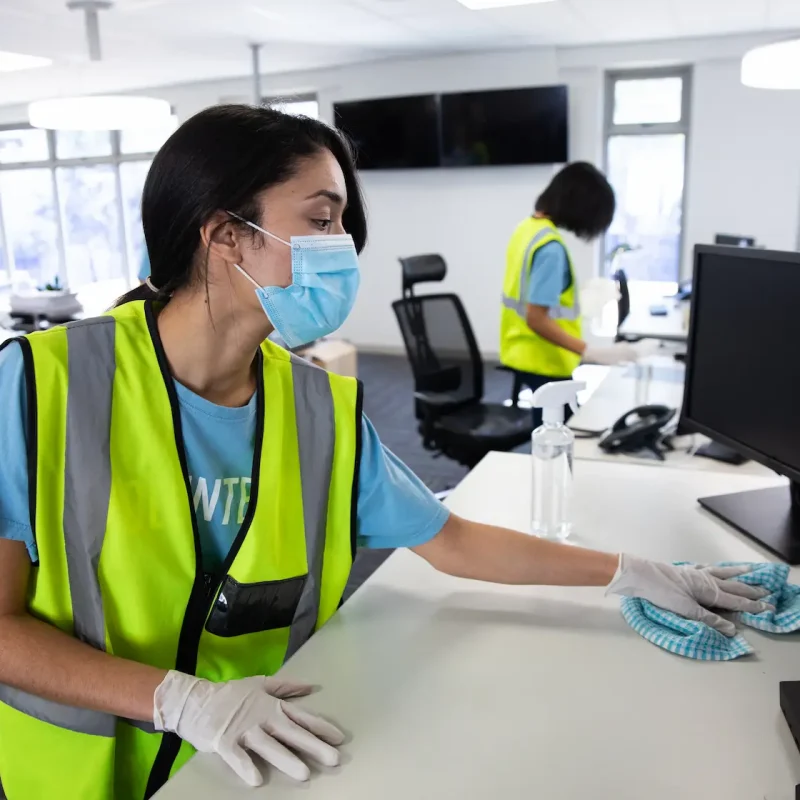 woman-wearing-hi-vis-vest-and-face-mask-cleaning-t-2023-11-27-04-49-08-utc