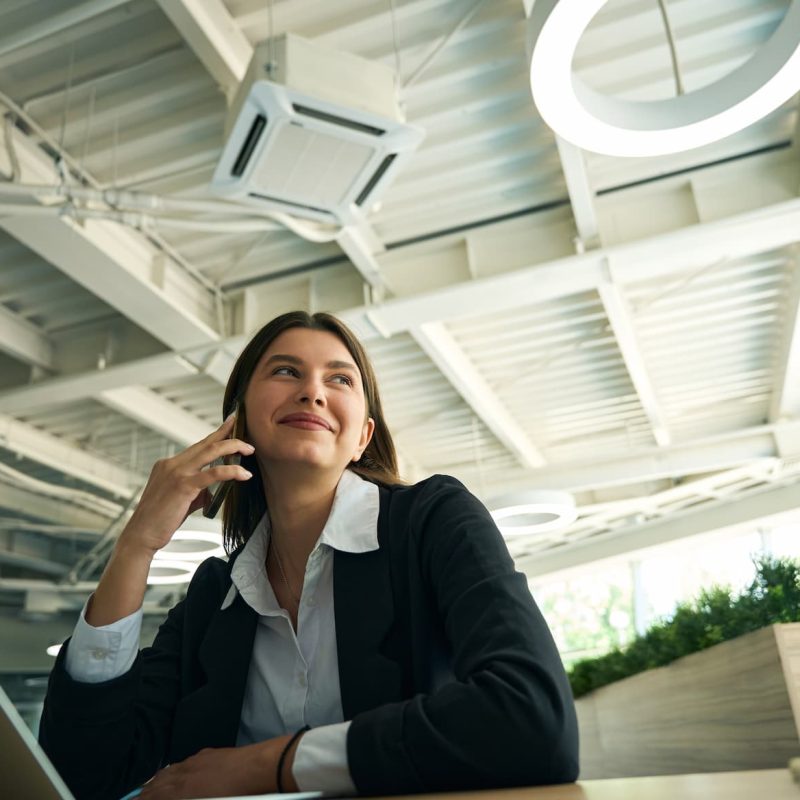 young-lady-sitting-at-her-workplace-in-a-jacket-2024-07-04-02-23-13-utc (1)